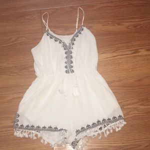 White and black romper with tassels
